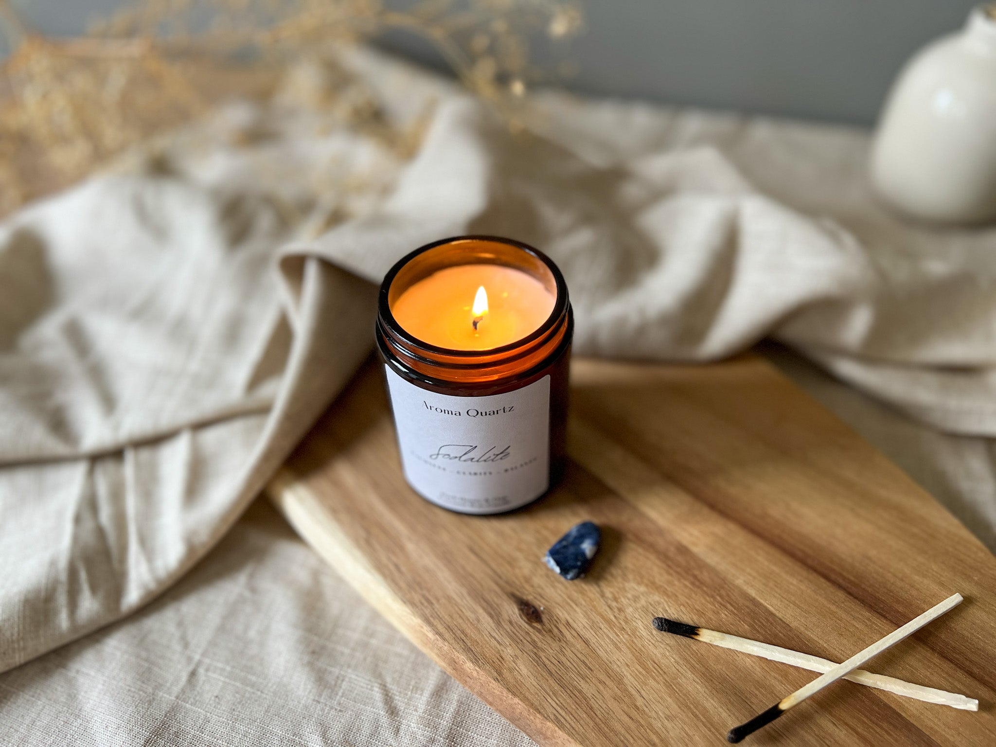 Sodalite Crystal candle being used in meditation and breathwork ritual to help calm the persons mind