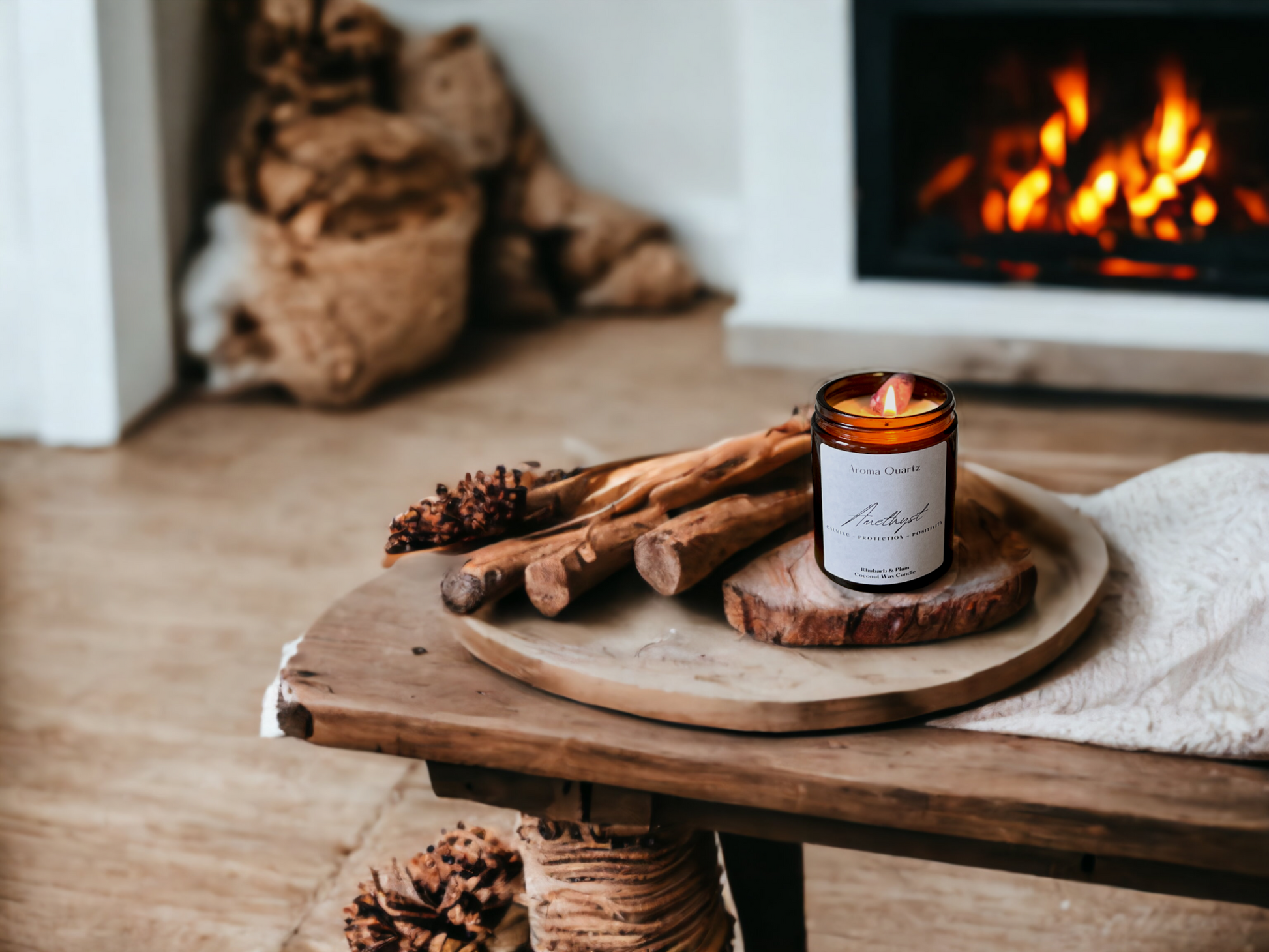 Coconut Wax candle on a rustic wooden table with wooden logs and log fire